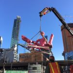 Crane Lifting Statue